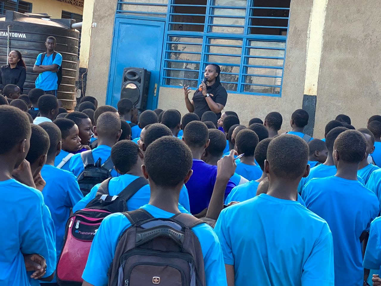 A QS Impact Kigali Council leader engaging students during Global Day of Action 2026